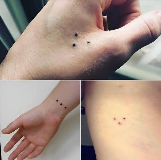 El misterio de los tres puntos tatuados: un emblema con múltiples interpretaciones